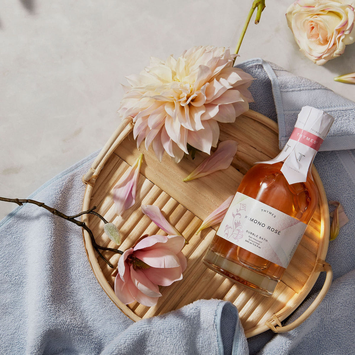 Alternate image of Thymes Kimono Rose Bubble Bath flat lay on wooden plate with florals