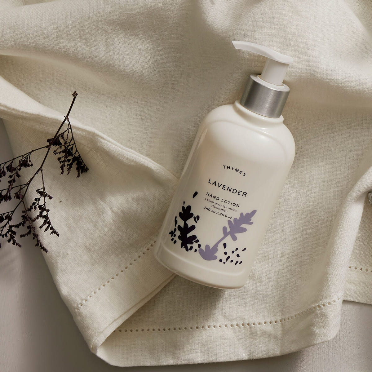 Alternate image of Thymes Lavender Hand Lotion on fabric