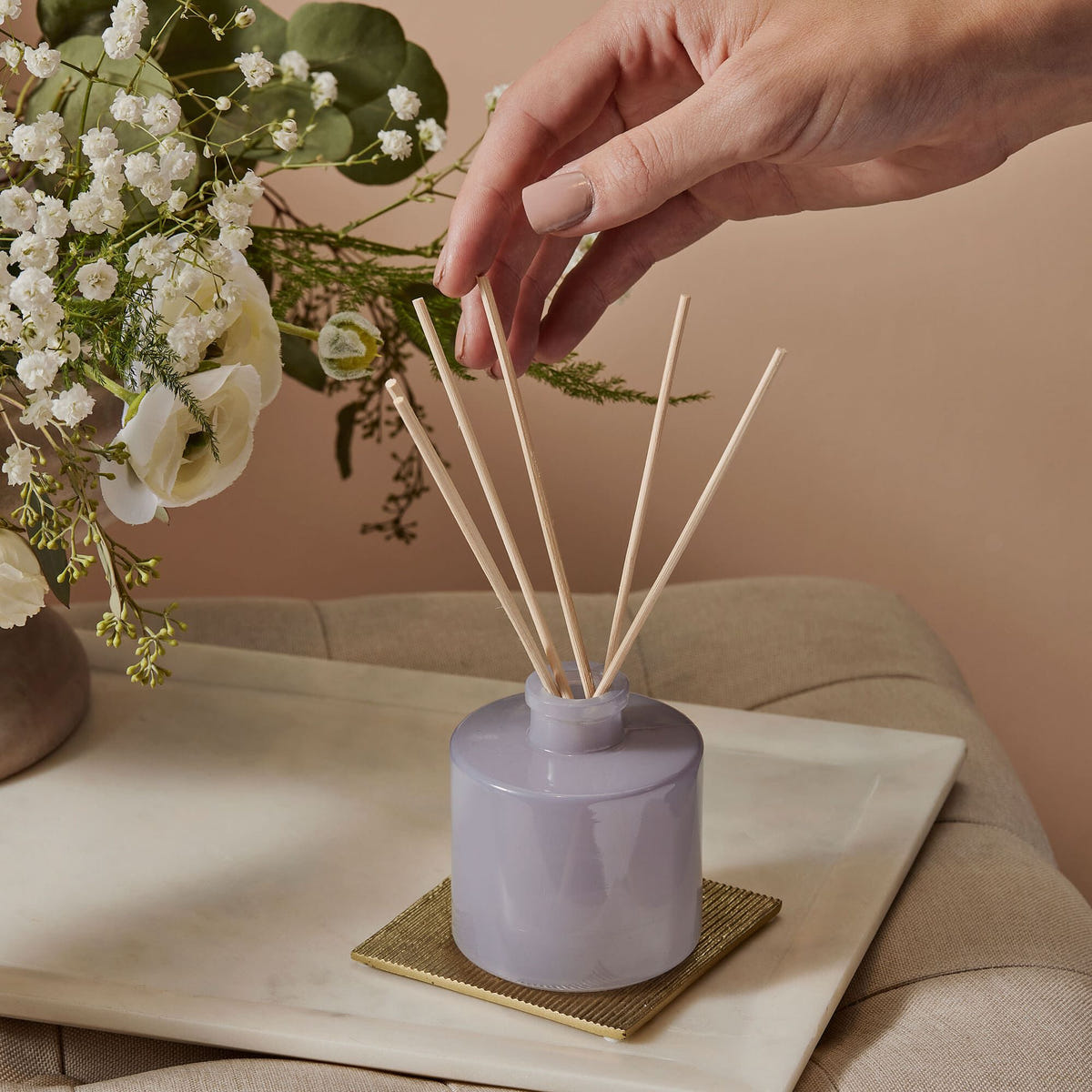 Alternate image of Setting up a Thymes Lavender Petite Reed Diffuser near vase of flowers