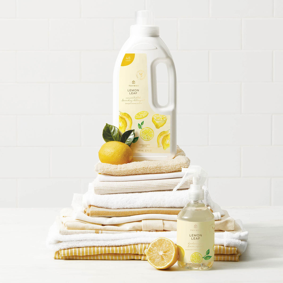 Alternate image of Thymes Lemon Leaf Concentrated Laundry Detergent on stacked linen