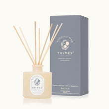 Thymes fragrance diffuser with sticks and packaging on a white background