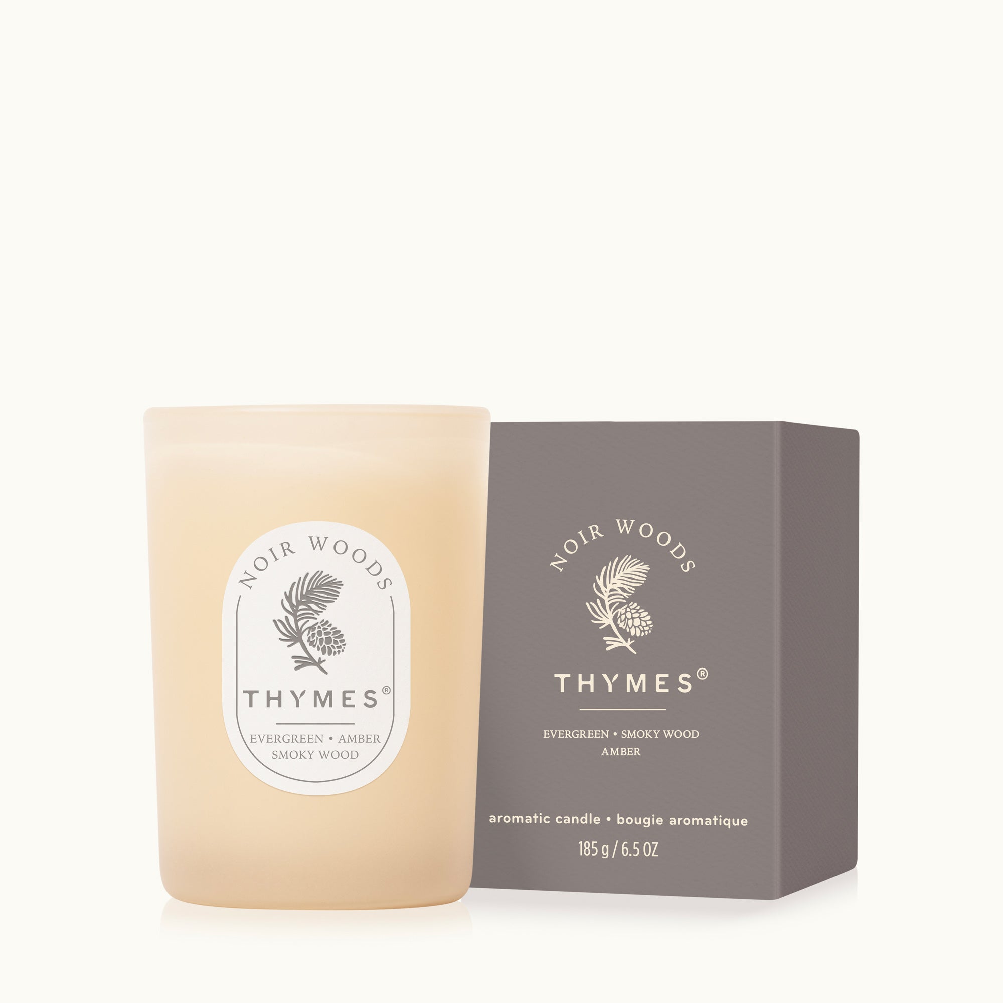 Thymes Noir Woods candle and packaging on a white background
