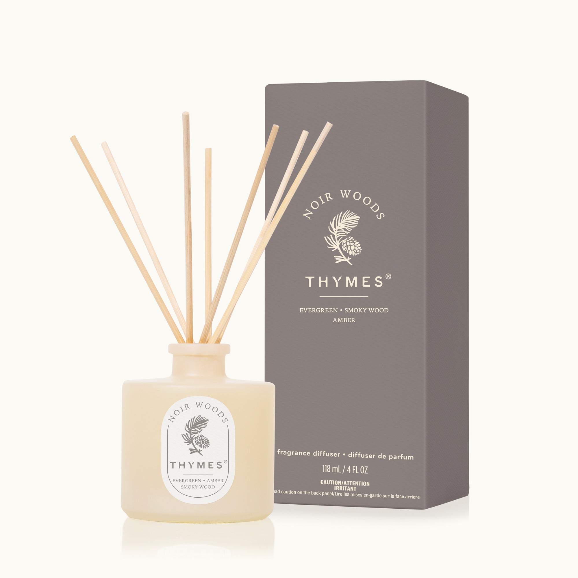 Thymes Noir Woods fragrance diffuser with packaging on a white background