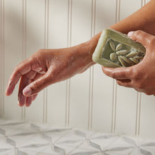 Thymes Olive Leaf Bar Soap with Moisturizing Bar Soap Formula being applied to arm