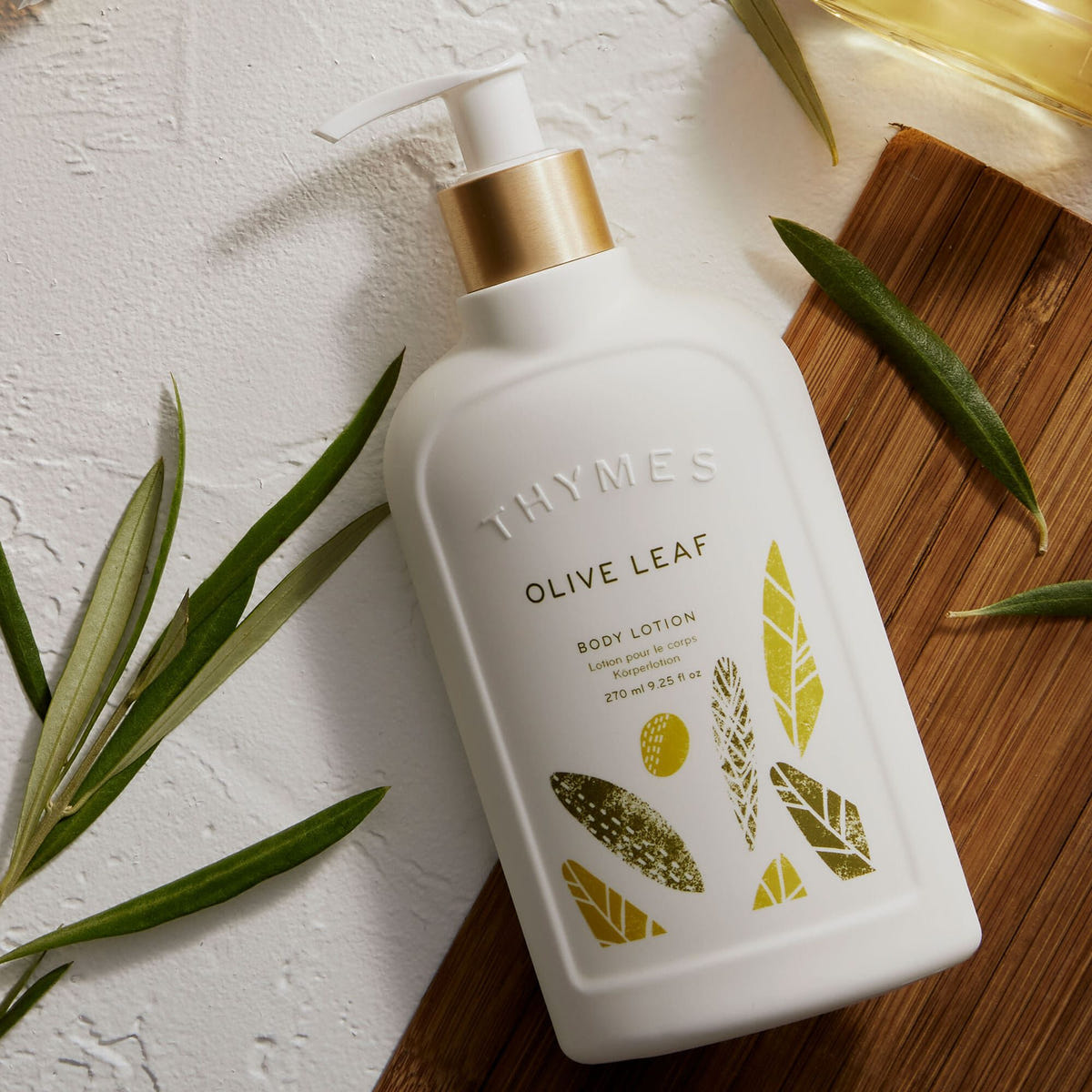 Alternate image of Thymes Olive Leaf Body Lotion on countertop