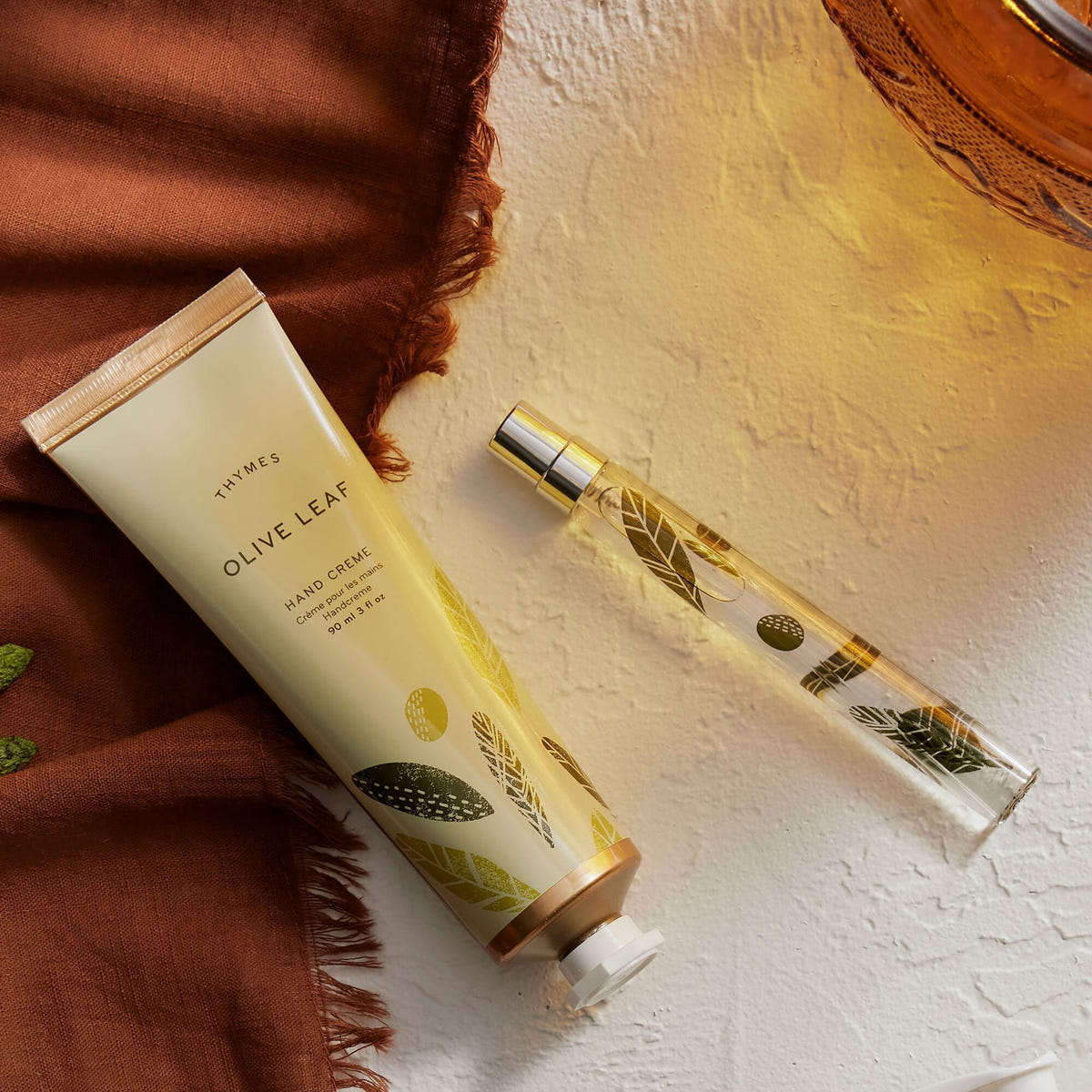Alternate image of Thymes Olive Leaf Cologne Spray Pen is a Travel Sized Unisex Fragrance next to Olive Leaf Hand Cream