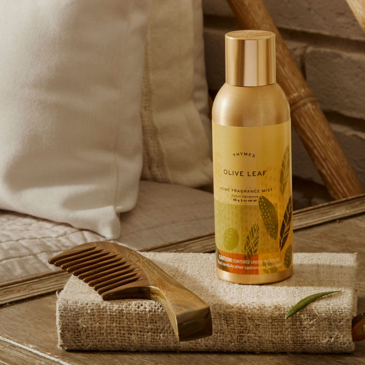 Alternate image of Thymes Olive Leaf Home Fragrance Mist on bedside table