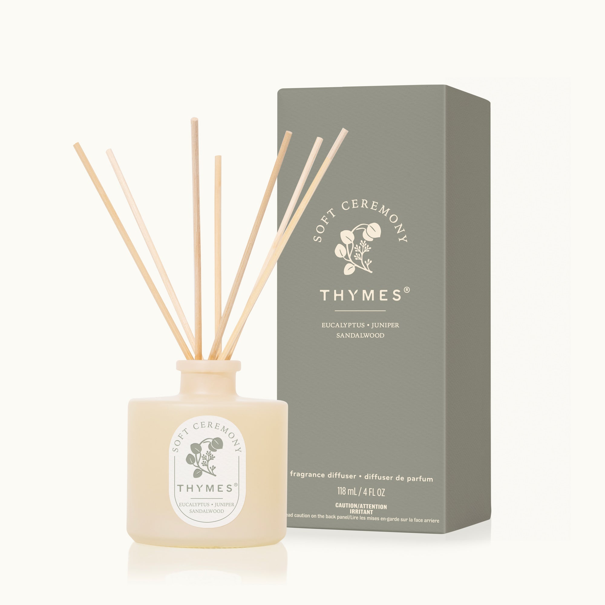 Thymes fragrance diffuser with sticks and packaging on a white background