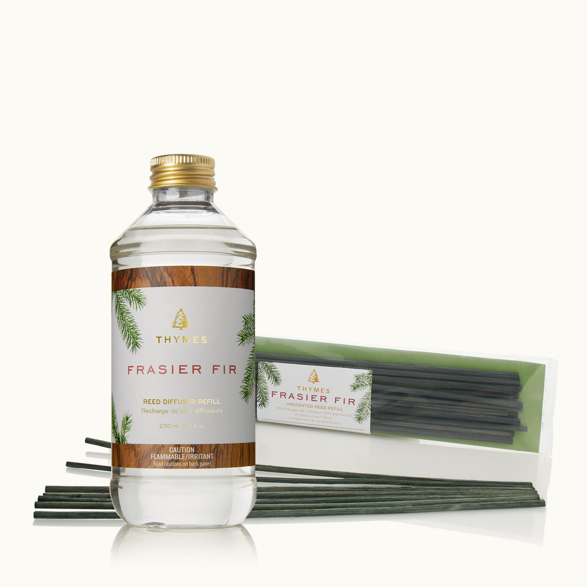 Frasier Fir Diffuser Oil Refill and Green Reed Refills on a tan background