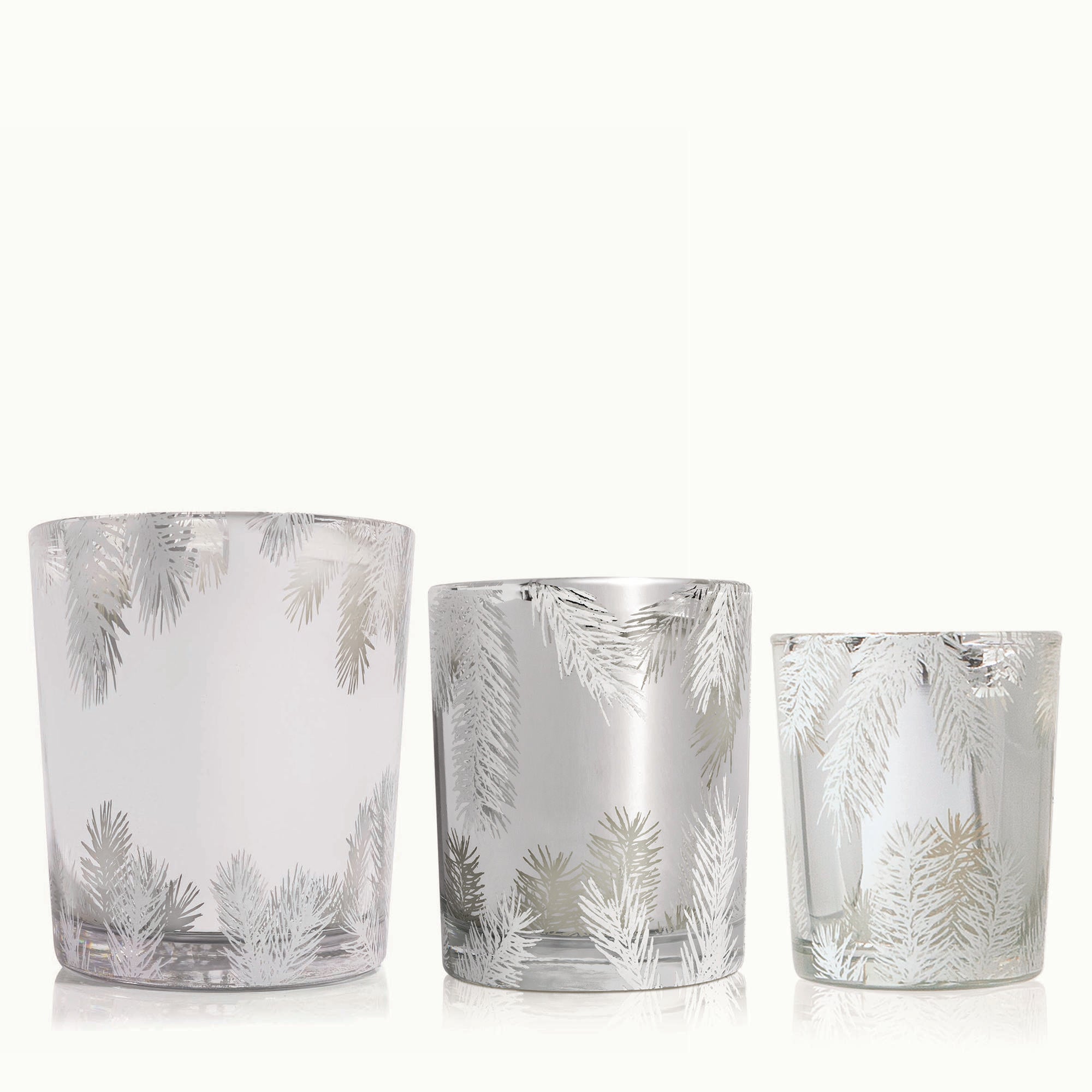 Three Frasier Fir Statement Candles on a white background