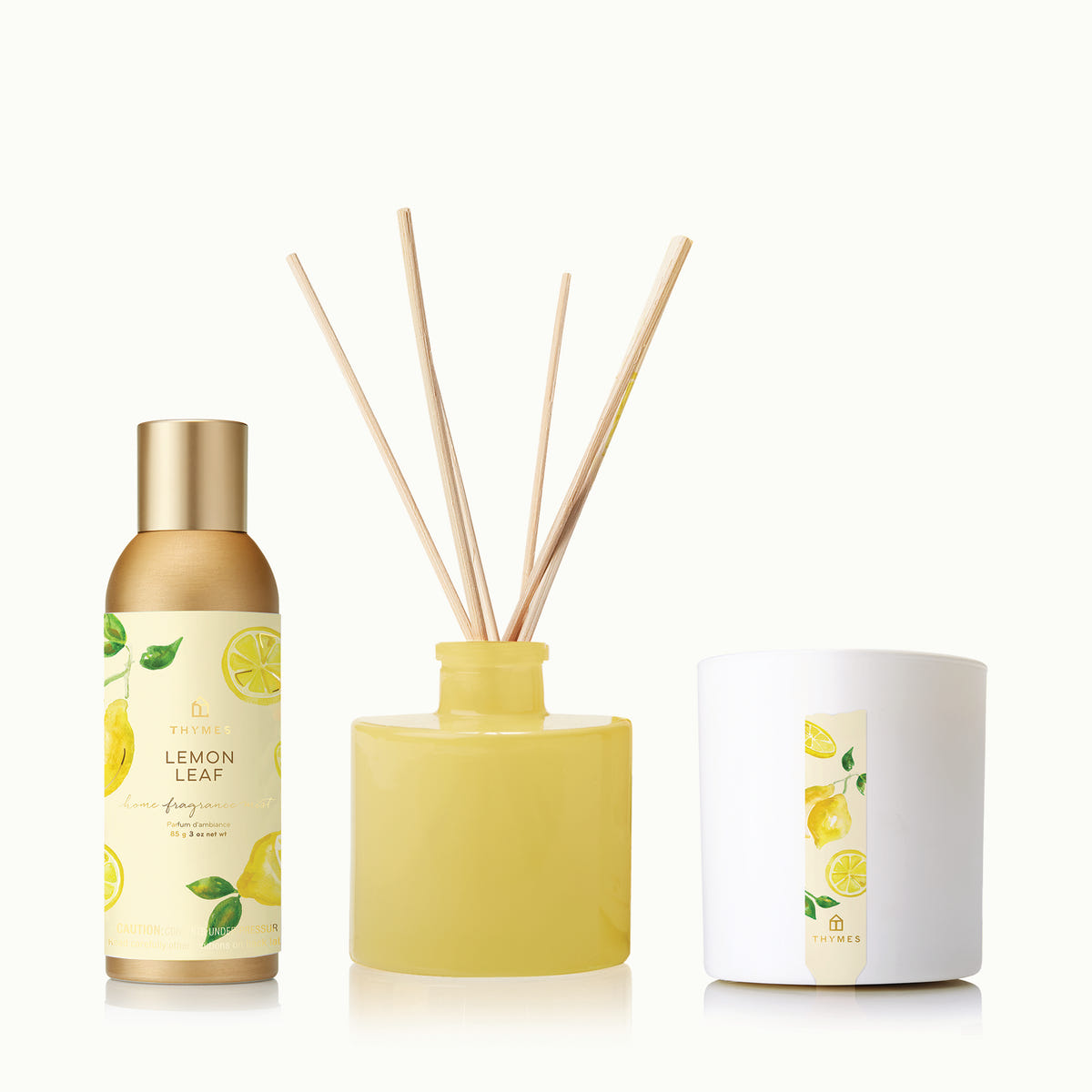 Set of three scented products with lemon leaf design on a white background