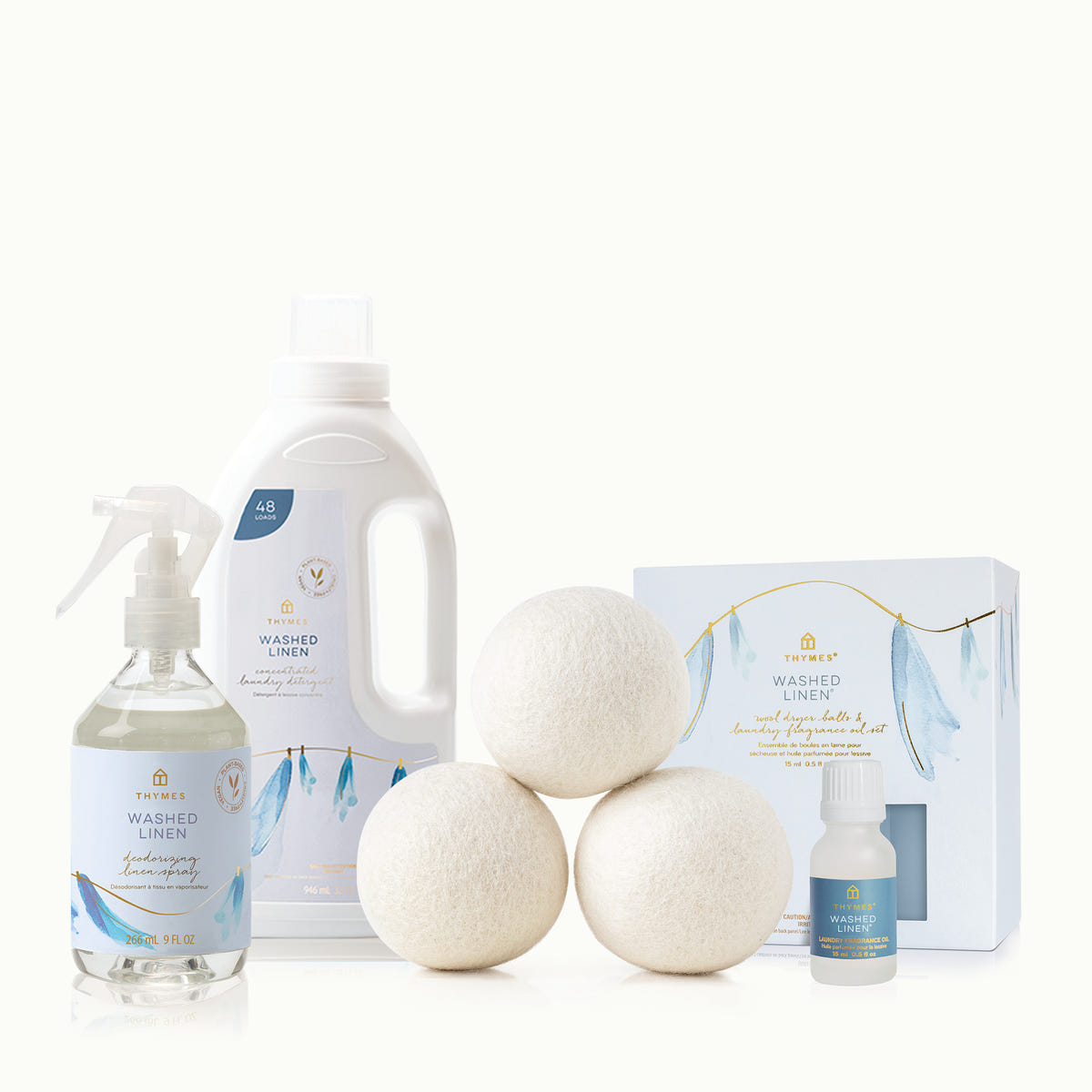 Set of laundry products including bottles, detergent pods, and packaging on a white background