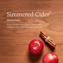 Apples and a tied bunch of cinnamon sticks