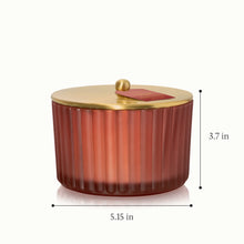 A 3 wick candle in a frosted ribbed glass with a height of 3.7 inches and a diameter of 5.15 inches
