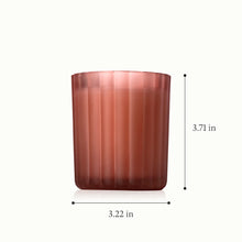 A candle in a frosted, ribbed glass vessel with a height of 3.71 inches and a diameter of 3.22 inches.