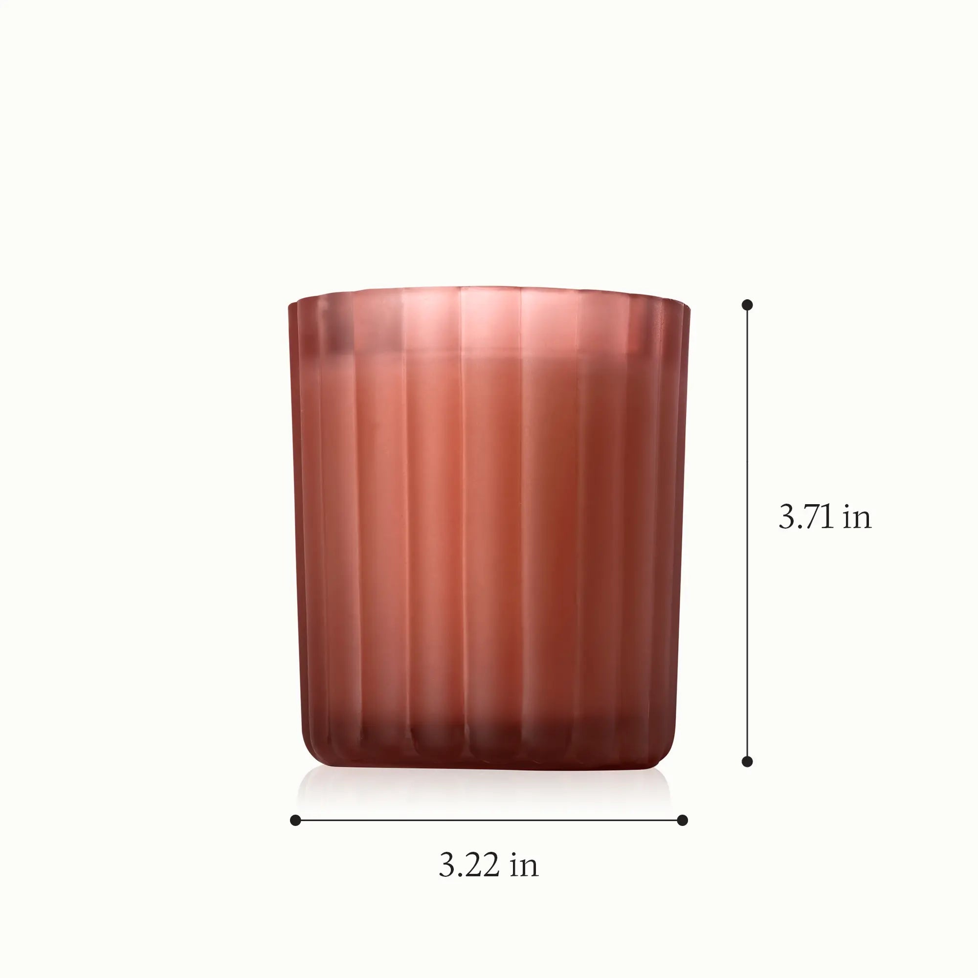 A candle in a frosted, ribbed glass vessel with a height of 3.71 inches and a diameter of 3.22 inches.