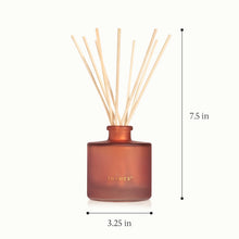 A frosted reed diffuser and inserted reeds with a height of 7.5 inches and a diameter of 3.25 inches.